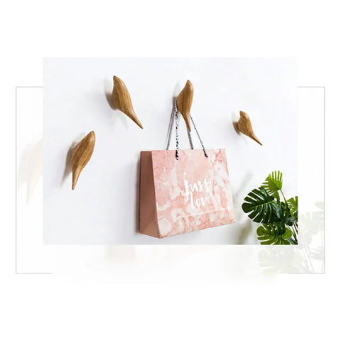 Straight Up Best Bird Shaped Resin Wall Hook With Wood Grain Finish For Coats And Hats Slick Wall Mounted Bedroom Organizer Smooth Edge Design Sweet Home Decor Plus Hassle Free Install with pink bag on wall.