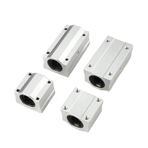 Set of four silver aluminum SCS-series linear bearing blocks in varying sizes with mounting holes