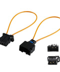 Two Velidy automotive fiber optic loop bypass adapters with orange cables; black plastic housings, front view.