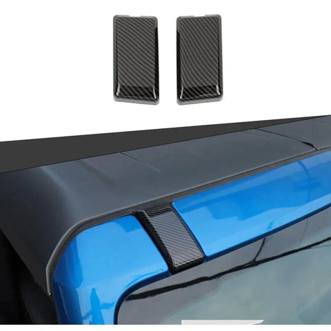 Slick Carbon Fiber Top Screws Protector Cover Trim Cap For 2021 Plus Vehicles shown on blue car roof, set of two, ABS material, stylish upgrade.