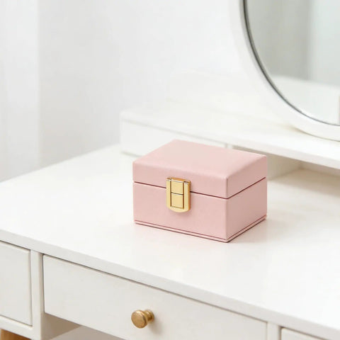 Rock Solid Lockable Metal Box Latches Gold Surface Mount Snap Fasteners With Spring Loaded Toggle Catches For Secure Wooden Jewelry Case Storage And Craft Gear on a pink box.