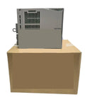 Side view of 1.5kW AC Servo Amplifier for High Precision Motion Control on cardboard box, industrial equipment