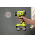Person using 18V Cordless Heat Gun For Quick Heating Tasks Like Shrink Tubing And Paint Removal Up To 875 Degrees Fahrenheit With A Fast Under Ten Seconds Heat Up DIY Friendly Tool Only on wall