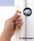 Hand holding Snazzy Clear Acrylic Cabinet Knob 20 Pack with Gold Finish for kitchen cabinet installation, shown close up.