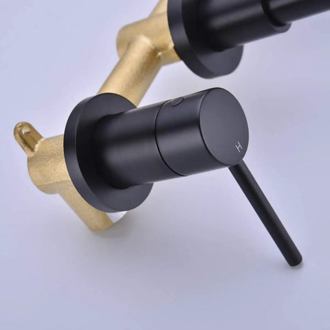 Close-up of Brass Matte Black Dual Handle Wall Mounted Bathroom Faucet With Rough In Valve, showing matte finish and solid brass build.