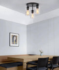 Three Light Industrial Farmhouse Black Matte Ceiling Light Fixture With Clear Glass Shades Semi Flush Mount in modern dining area.
