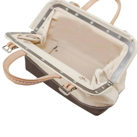 Heavy Duty Natural Canvas Tool Bag Tote With Wide Hinged Opening And Leather Handles, interior view showing steel frame.