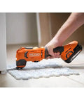 18V Cordless Oscillating Multi Tool Kit With Two 2.0Ah Batteries And Charger Quick Change Accessory System in use on floor tiles