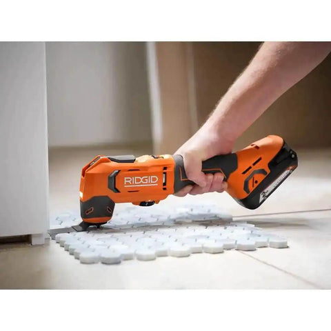 18V Cordless Oscillating Multi Tool Kit With Two 2.0Ah Batteries And Charger Quick Change Accessory System in use on floor tiles
