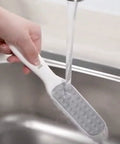 Rinsing foot file from Easy At Home Foot Care Kit With Quick Peel Spray And Foot File Rasp For Callus Removal under tap