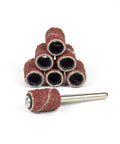 Premium Corundum Sanding Drum Bands Compatible With Rotary Drills For Metal Polishing And Deburring Featuring Badass Abrasive Grit and Works Like A Charm Performance With Smooth Operator Finish 100 Piece Kit with different grit sanding drums stacked.