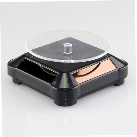 Solar Powered Rotating Jewelry Display Stand With Built In Kickstand, sleek ABS turntable riser for collectibles.