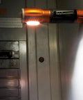LED Flashlight And Work Light With Magnetic End on electrical panel, compact, durable and waterproof for hands free illumination