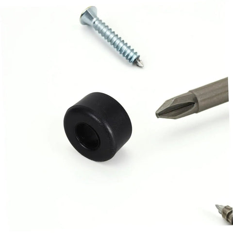 Black PU shock cushion for quad skates, surrounded by a screwdriver and screw, from 10 Pack PU Shock Absorbing Cushions for Quad Skates.