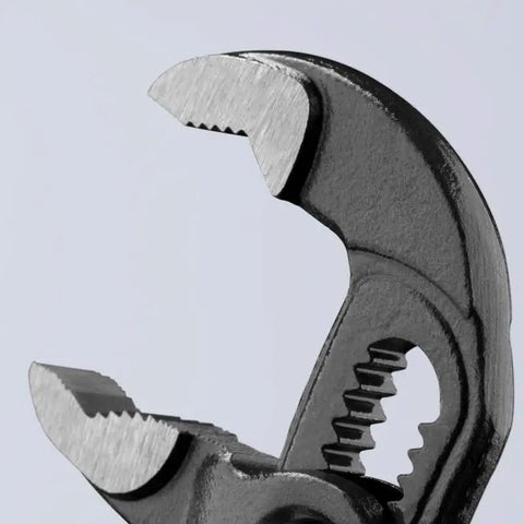 Close-up of Cobra Water Pump Pliers, 5 Inch, Red, Adjustable Pliers with self-locking teeth and 13 positions for pipes and nuts.