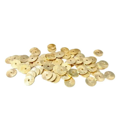 Top Shelf 8mm Gold Disc Brass Spacer Beads Featuring Gleaming 14K Gold Plated Finish scattered on white background.