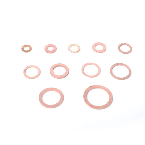 Ultimate 280-Piece Solid Copper Sump Plug Washer Set Kit With Complete Metric Pack Oil Drain Seals For Auto And Marine Engines To Stop Drip Leaks Like A Boss During Quick Maintenance And Major Repairs. Assorted copper sump plug washers on white background