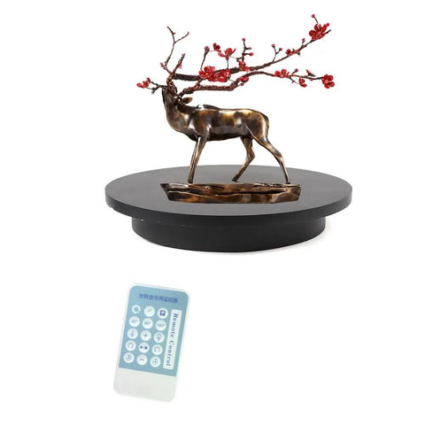 Rock The 16 5 In Electric Rotating Display Stand With Heavy 100 Kg Load For Smooth 360 Spin Photography And Video Shots Plus Remote Control Speed Adjust For Jewelry and E-Commerce Selling with decorative deer sculpture and remote.