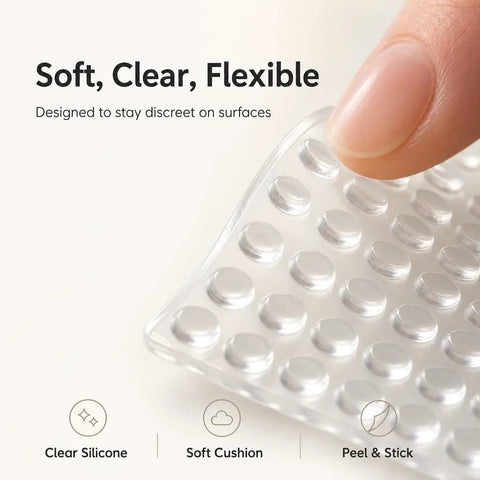 Close-up of soft clear silicone cabinet door bumpers, showing flexible rubber pads for cabinets and drawers.