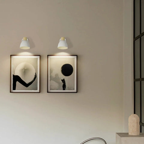 Modern Battery Powered Wall Sconces Set Of Two With Remote In White Wood Rotatable Dimmable Indoor Wall Lamps displayed above art pieces