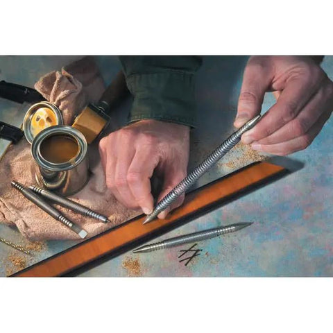 Badass Nail Set Fits 1/32 To 2/32 Inch Brads displayed on a workbench with hands showing precision use for trim carpentry.