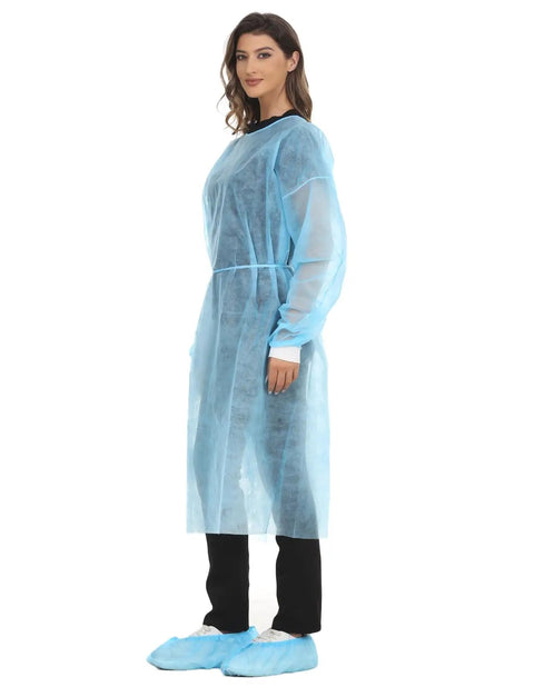 Side view of a person wearing Disposable Isolation Gown Polypropylene Lab Gown With Knit Cuff Long Sleeve Lightweight Yet Durable.