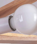 Slick Modern Metal 5 Light Pendant Chandelier Ceiling Lamp E27 socket close-up showing bulb attachment and wooden accent.