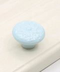 Light blue ceramic mushroom cabinet knob from the 15 Piece Ceramic Mushroom Cabinet Knob Set With 3 Size Mounting Screws Glossy Vintage Dresser Drawer Cupboard Pulls For Furniture DIY Wardrobe Solid Color Hardware Easy Install Durable Alloy Core on a white surface