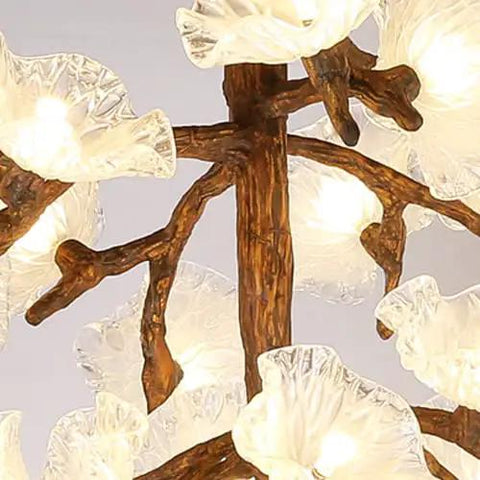 Close-up of Tree Branch Ceiling Pendant Light Straight Up Fresh Statement Chandelier with clear flower shades and brown branch design.