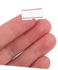 Close-up of hand holding Self Adhesive Price Tag Labels For Price Tag Machine, 10 Rolls, 6000 Pieces, white label with red lines