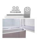 Heavy Duty Galvanized Steel Fridge Door Hinge Set For Universal Refrigerator And Freezer Repair With Anti Pinch Buffer Tight Seal Quiet Close High Load Bearing No Fuss Easy Install Replacement shown next to an open fridge door