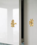 Vintage Brass Pig Shaped Drawer Pulls Chinese Style Decorative Cabinet Handles For Small Drawers Dressers Wardrobes And Storage Boxes Retro Hardware With Easy Maintain Shine shown on a white cabinet