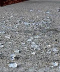 Heavy Duty Five Gallon Concrete Sealer With Water Based Siliconate Formula For No Sweat Salt And Water Repellency Against Cracking Pool Damage showing water beads on protected concrete surface.
