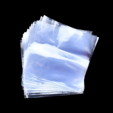 4 X 4 Inch Heat Shrink Bags 300 Pack Slick Glossy Polyolefin Film in a stack, perfect for wrapping soap bars and crafts.