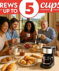 Group of friends enjoying breakfast with Five Cup Coffee Maker With One Touch Brew Pause And Serve Function Keeps Warm As You Sip Stainless Steel Accents Black Finish No Fuss Quick Mornings And Sharing Coffee on table.