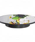Premium Electric Rotating Display Stand With Mirror Black Finish shows flowers reflected, ideal for product photography.