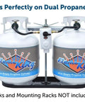 Two Flame King 20-lb propane tanks on a dual rack with central auto-changeover regulator and hoses.