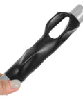 Hand holding black Golf Grip Trainer Pro Grade Swing Training Device Alignment Aid And Putting Practice Tool