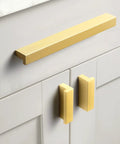 12 Pack Light Brushed Brass Tilted Drawer Pulls for Cabinets, Solid Aluminum Alloy Finger Pull Handles, mounted on cabinet