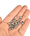 Killer 20 Pack Tungsten Teardrop Jig Heads Without Hooks, Heavy 97 Percent Alloy DIY Welding Bodies Sweet For Ice Fishing, Unpainted 4mm, held in a hand.