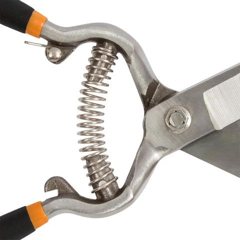 Close-up of spring mechanism on Pro Grade Forged Grass Shears For Precise Edging And Thick Sod Spring Action Opens Blades After Each Cut