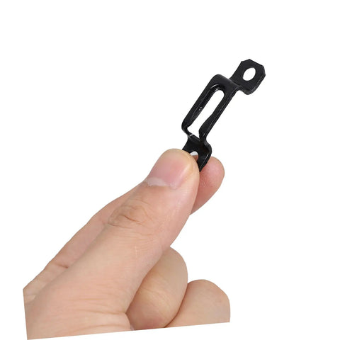 30 Pack Of Concealed Furniture Connector Brackets And Heavy Duty Metal Clamps For Bulletproof Cabinet Setup Tight Seal No Loose Ends Smooth Install Top Shelf Grade Materials For Real Dealers And Home Builders - black metal connector held in hand.