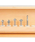 Precision Tuned Six Piece CNC Lettering Router Bit Set Packing Dead Nuts Accurate 1/4 Inch Shanks in wooden case for smooth cutting.
