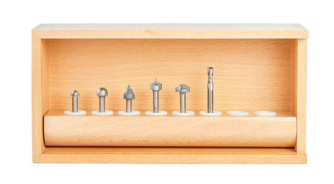 Precision Tuned Six Piece CNC Lettering Router Bit Set Packing Dead Nuts Accurate 1/4 Inch Shanks in wooden case for smooth cutting.