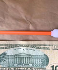 Foam cleaning swab with orange handle and white foam tip, 5.11 in, for electronics/cameras; 1 swab and 1 $10 bill shown