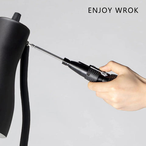 Hand using Compact 3.6V Cordless Electric Screwdriver With LED Light And USB C Charging on black device