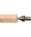 DEEFIINE MT2 live tailstock center for wood lathe, steel body with conical tip; side view contacting a wooden block