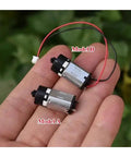 Top Rate N20 Micro Planetary Gearbox With 6 VOLT Direct Current Power Delivering A Slick 12mm Cross Shaft Cruising Chill At 117Rpm Straight Up Dope Gear For Diy Robot Cars And Home Automation Projects That Run Smooth As Silk Daily, showing Model A and Model B gear motors in hand.