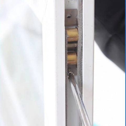 Close-up of Heavy Duty Double Wheel Sliding Door Roller And Replacement Window Pulley being installed with a screwdriver.