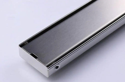 Solid Stainless Steel Floor Drain Catcher With Built In Hair Trap For Showers And Sinks Gravity Drainage Keeps Pipes Clear Zero Drama Cleanup Smooth Rectangular Sink Plug Cover close-up view of polished stainless steel drain cover